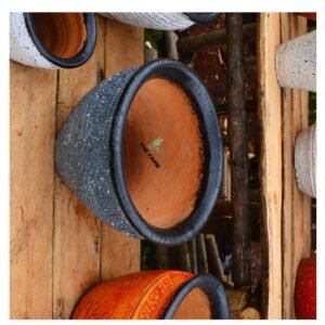 round speckled clay pot with a glossy rim