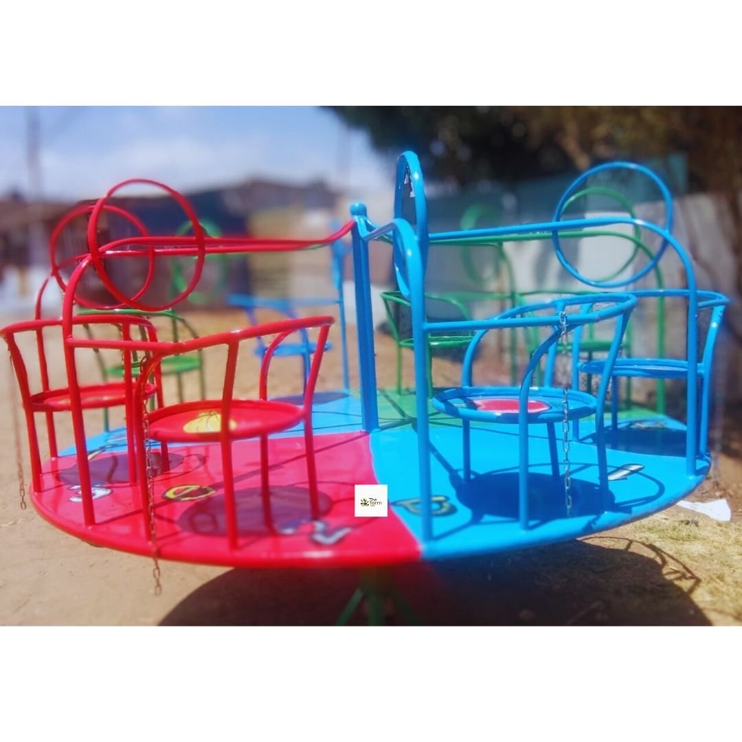 Merry-Go-Round 6-Seater featuring colorful red, blue, and green seats with sturdy handles and a smooth spinning mechanism, set in a playground.