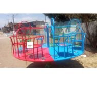 Merry-Go-Round 6-Seater featuring colorful red, blue, and green seats with sturdy handles and a smooth spinning mechanism, set in a playground.